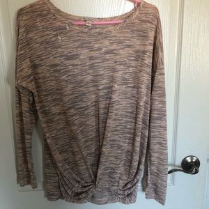 pink top tied in the front